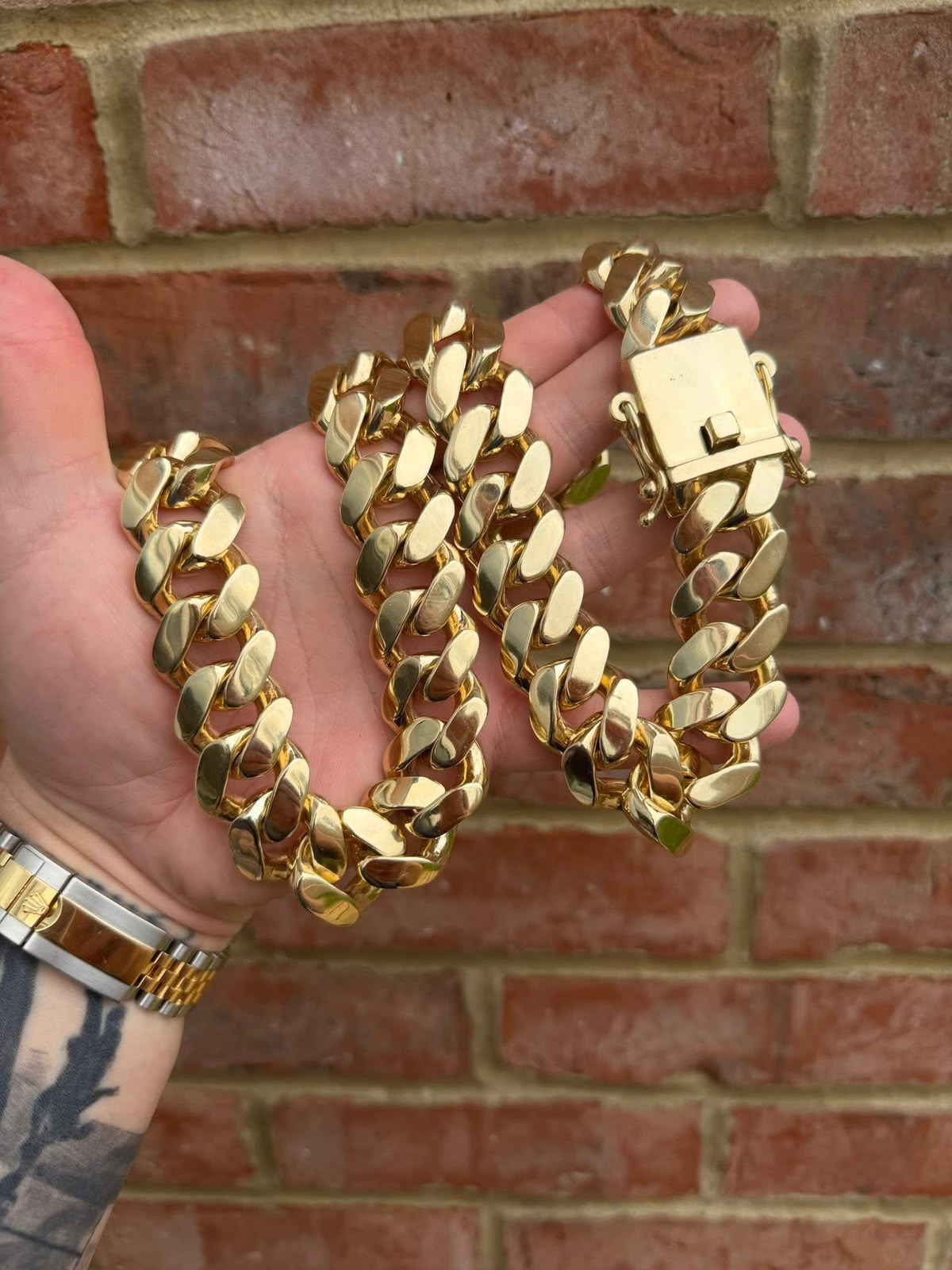 Heavy polished gold curb chain with a box clasp